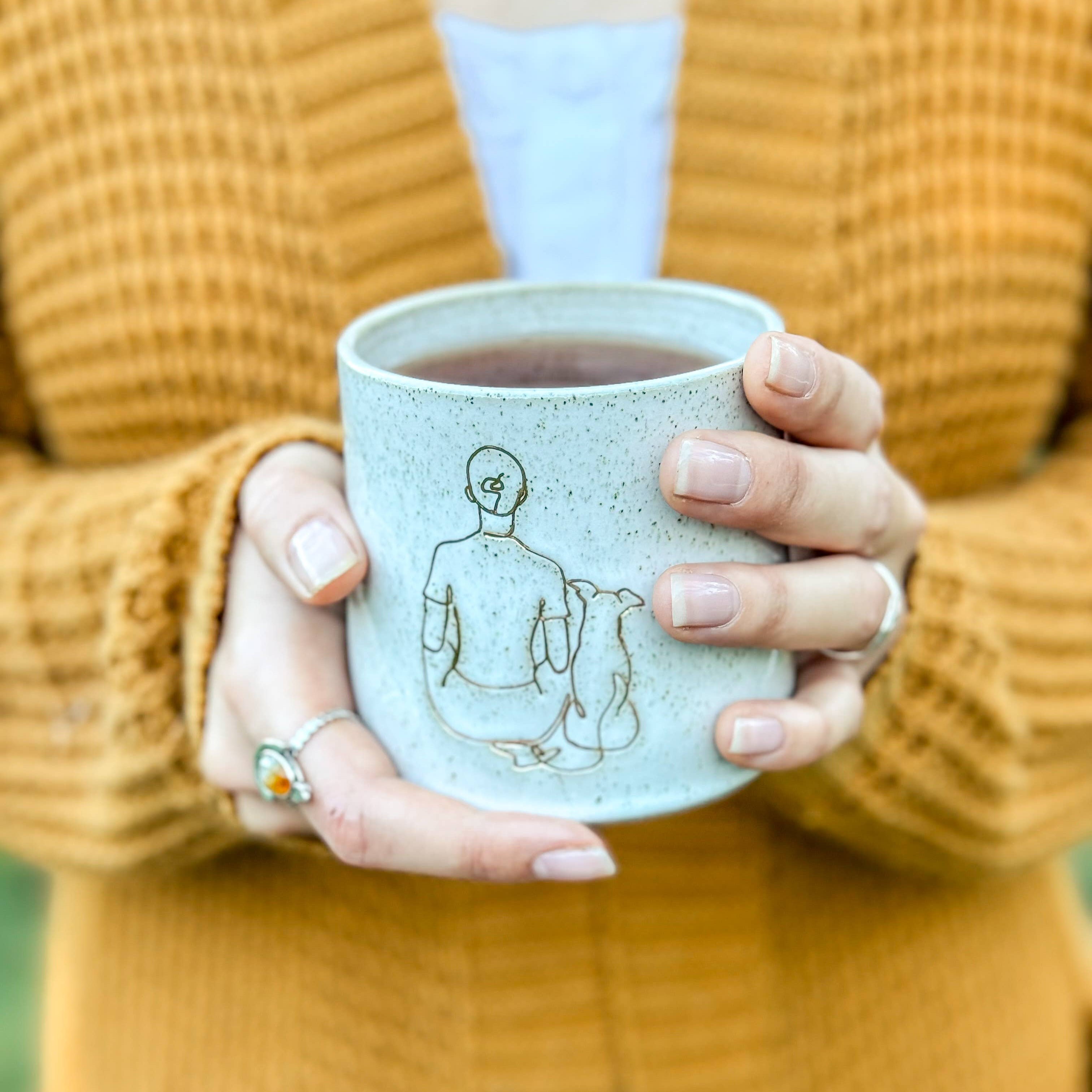 Ceramic Mug - Girl sitting with small dog: Right-handed design Wolf and Clay Pty Ltd