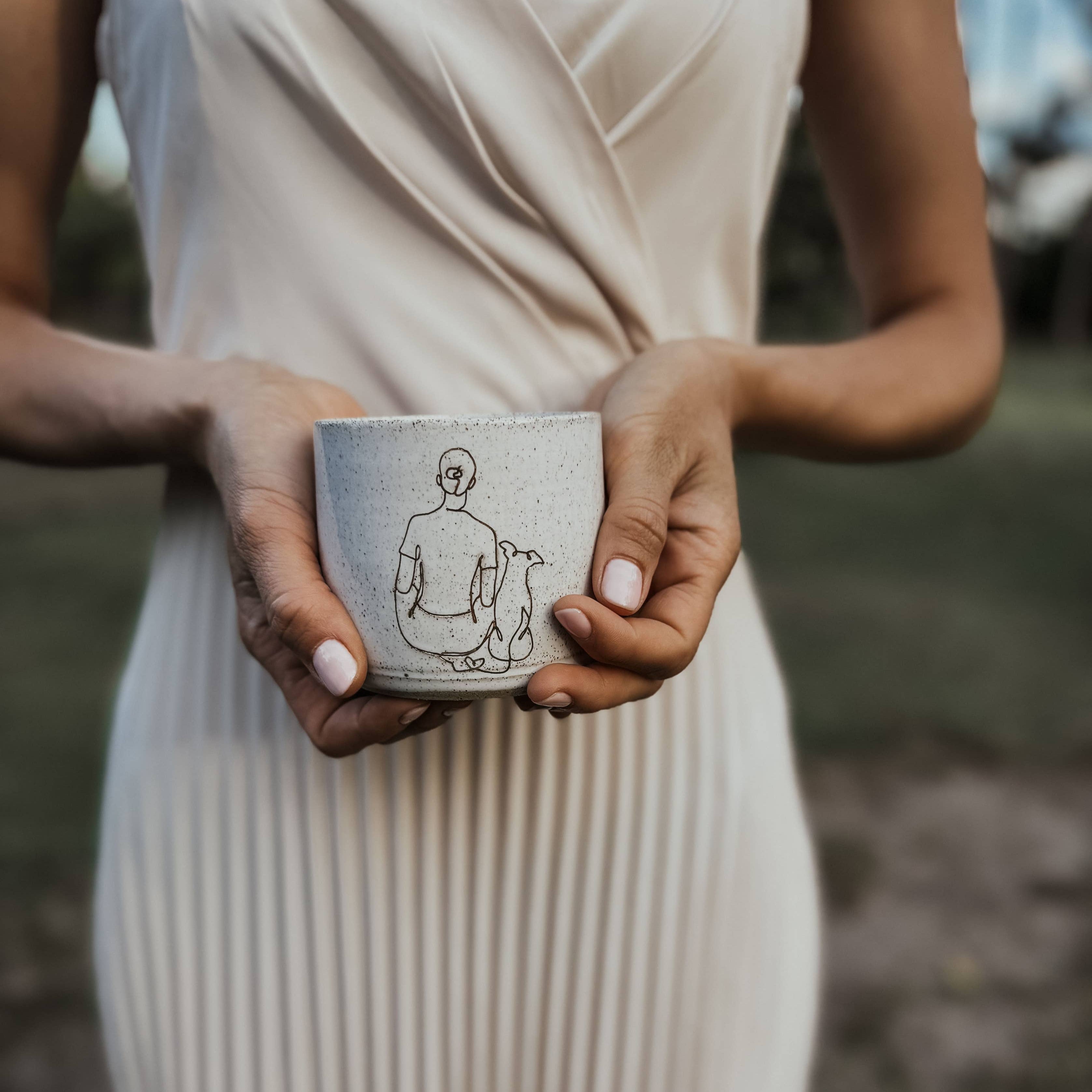 Ceramic Mug - Girl sitting with small dog: Right-handed design Wolf and Clay Pty Ltd